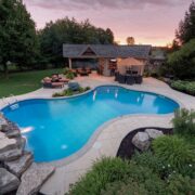 Should I put wood or stone around my pool?
