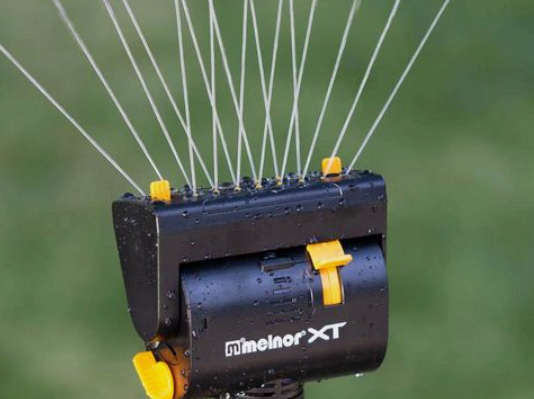 Oscillating sprinklers: a device that sprays water in a back-and-forth motion to water lawns or gardens